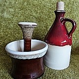 Poland, Red Ceramic Bottle and Herb Grinder